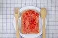 Whole wheat bread with red strawberry jam Royalty Free Stock Photo