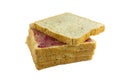Whole wheat bread stack with grape jam on isolated white background. Royalty Free Stock Photo