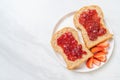 whole wheat bread with strawberry jam and fresh strawberry Royalty Free Stock Photo