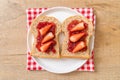 whole wheat bread with strawberry jam and fresh strawberry Royalty Free Stock Photo