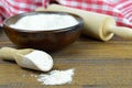 Whole wheat flour in wooden bowl,wooden scoop and rolling pin Royalty Free Stock Photo