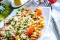 Whole wheat fusilli pasta with cheese and cherry tomatoes Royalty Free Stock Photo