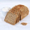 Whole wheat grain bread slice slices sliced loaf square on wooden board Royalty Free Stock Photo