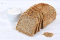 Whole wheat grain bread slice slices sliced loaf on wooden board Royalty Free Stock Photo