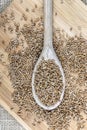 Whole wheat grains in a wooden spoon on a wooden table Royalty Free Stock Photo
