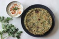 Whole wheat methi thepla rolls with paneer capsicum filling and a bowl of masala curd