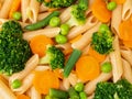 Whole wheat pasta Penne with broccoli, carrots, green peas. Close-up, macro. Diet menu, proper nutrition, healthy food Royalty Free Stock Photo