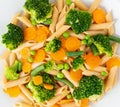 Whole wheat pasta Penne with broccoli, carrots, green peas. Close-up, macro. Diet menu, proper nutrition, healthy food Royalty Free Stock Photo