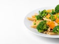 Whole wheat pasta Penne with broccoli, carrots, green peas. Part of plate. Diet menu, proper nutrition, healthy food Royalty Free Stock Photo