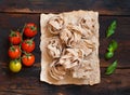 Whole wheat pasta tagliatelle, tomatoes and basil Royalty Free Stock Photo