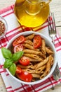 Whole wheat pasta with tomatoes, Basil, olive oil, seasonings Royalty Free Stock Photo