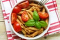 Whole wheat pasta with tomatoes, Basil, olive oil, seasonings Royalty Free Stock Photo