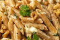 Whole Wheat Penne pasta with gorgonzola cheese sauce, spinach and walnut. Healthy food. Royalty Free Stock Photo