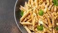 Whole Wheat Penne pasta with gorgonzola cheese sauce, spinach and walnut. Healthy food. Royalty Free Stock Photo