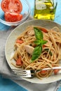 Whole wheat spaghetti with mackerel fillets and tomato