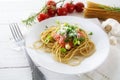 Whole wheat spaghetti pasta with fresh tomato sauce and spring o Royalty Free Stock Photo