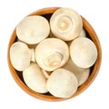 Whole white champignon mushrooms in wooden bowl Royalty Free Stock Photo