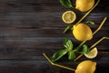 Whole yellow juicy lemons, Basil, cocktail tubes on a dark wooden background, citrus, top view Royalty Free Stock Photo