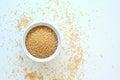 Wholegrain couscous in the bowl on the white background