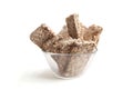 Puffed buckwheat cakes in glass bowl isolated on white background.