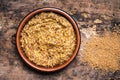 Wholegrain mustard in a wooden bowl on a table