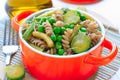 Wholegrain pasta with green vegetables in ceramic pan