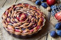 Wholegrain plum pie, damsonpie on the ceramic plate. Rustic style.