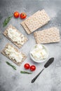 Wholegrain Rye Crispbread with cream cheese, on gray stone table background, top view flat lay Royalty Free Stock Photo