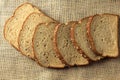 Wholegrain sliced organic bread composed of oats and flax seeds on wooden table. Healthy Diet