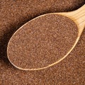 Wholegrain teff seeds in wood spoon closeup Royalty Free Stock Photo