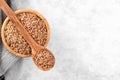 Wholegrain uncooked raw spelt farro in wooden bowl on grey stone table Royalty Free Stock Photo