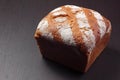 Wholemeal bread on dark board Royalty Free Stock Photo