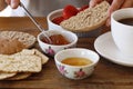 Wholemeal bread with jam for breakfast, woman& x27;s hands prepating food Royalty Free Stock Photo