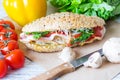 Wholemeal bun with chicken and dried pepper Royalty Free Stock Photo