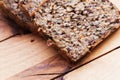 Wholemeal, wholewheat bread on wooden table. Organic, healthy food