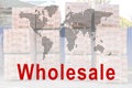 Wholesale business. World map and pallets with bricks on background
