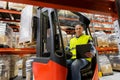 Loader with clipboard in forklift at warehouse