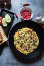 Wholesome breakfast food items frittata served with bread along with condiments. Royalty Free Stock Photo