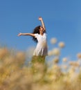 Wholesome brunette woman outdoors in a field Royalty Free Stock Photo