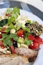 Wholesome Delights: A Plate of Nutrient-Rich Vegetables, Grilled Chicken, and Seed Bread