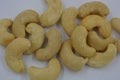 Wholesome and healthy food, natural nuts, large cashew nuts arranged on a white background.