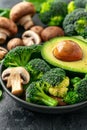 Wholesome vegan lunch bowl with avocado, mushrooms, broccoli, and spinach for a nutritious meal