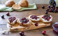 Wholewheat toasts with ricotta and homemade sweet cherry jam