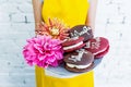 Whoopie pies on a tray with flowers, women`s hands. Congratulations.