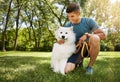 Whos a good boy. a handsome young man walking his dog in the park. Royalty Free Stock Photo