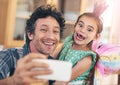 Whos got the greatest daughter in the world I do. a happy father and daughter taking a selfie together on a mobile phone Royalty Free Stock Photo