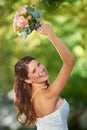 Whos the next to get hitched. Rearview shot of a happy young bride about to toss her bouquet over her shoulder.