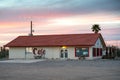 Exterior side view of Grannymacs Kitchen, a diner serving American food. Taken at sunset