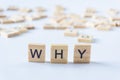 WHY cube blocks on white background. Wooden blocks with the word WHY. Why on wood cube - Business Concept