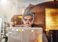 Why didnt I backup my files...a young man looking stressed while using a laptop in a cafe. Royalty Free Stock Photo